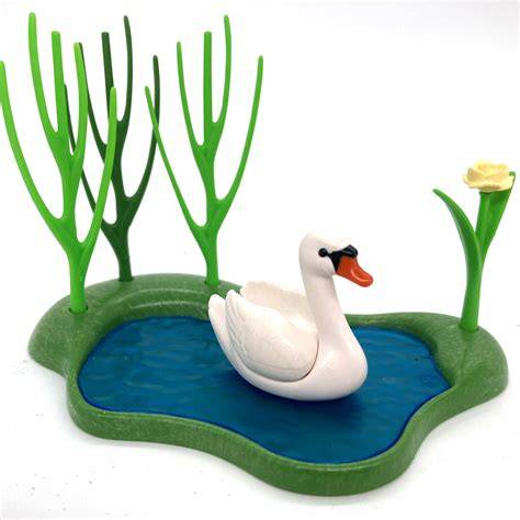 étang miniature avec cygne et pont de pierres